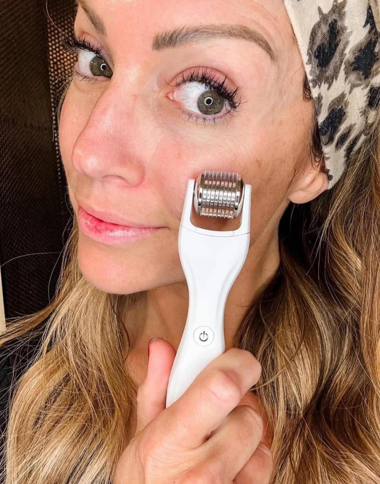 Woman using a GloPRO skin care device on her face
