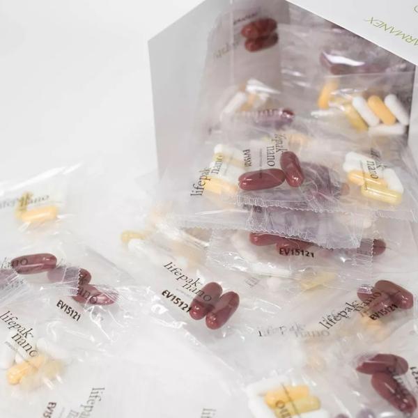 Packaged herbal supplements with visible branding on a white background