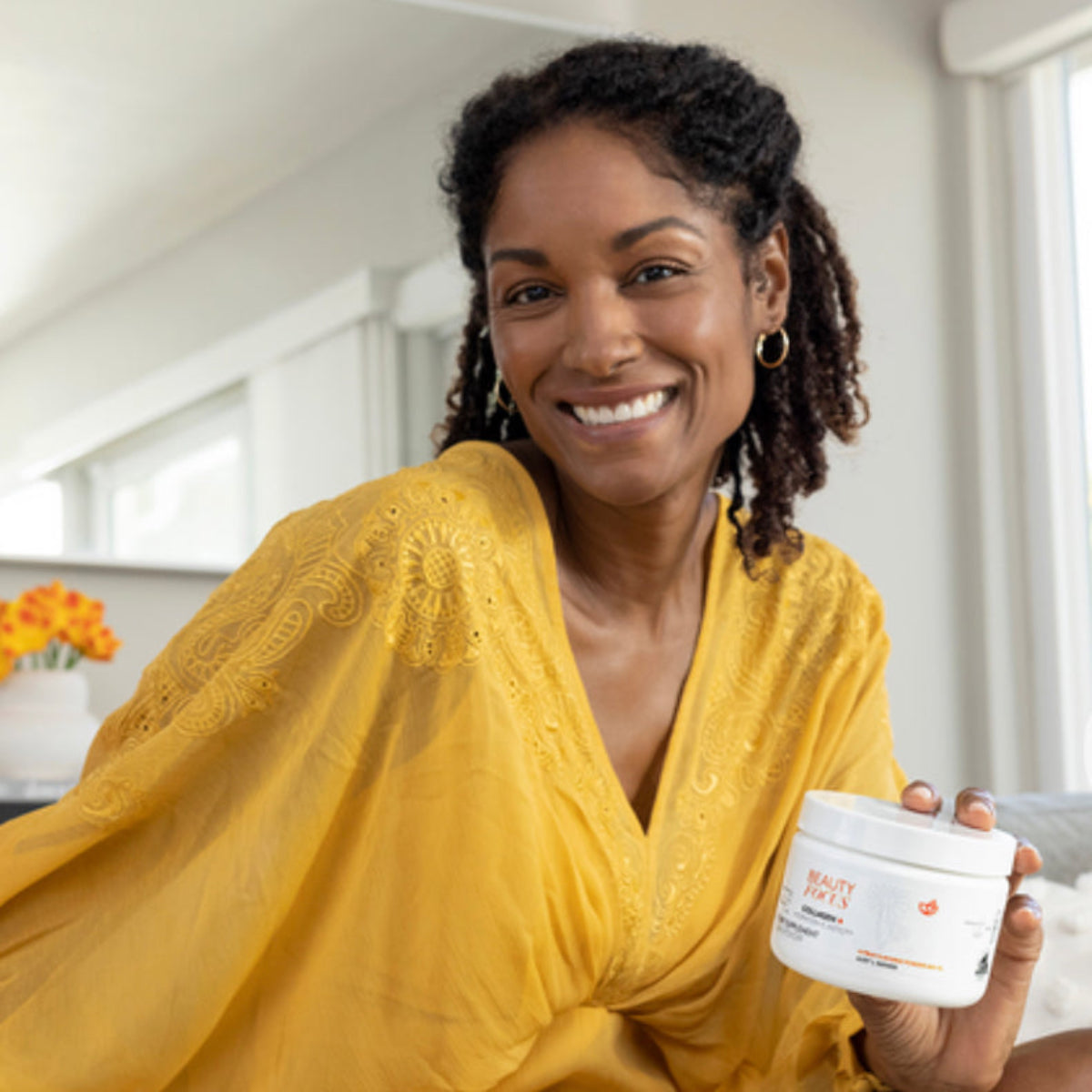 Nu Skin Beauty Focus Collagen - Woman holding jar