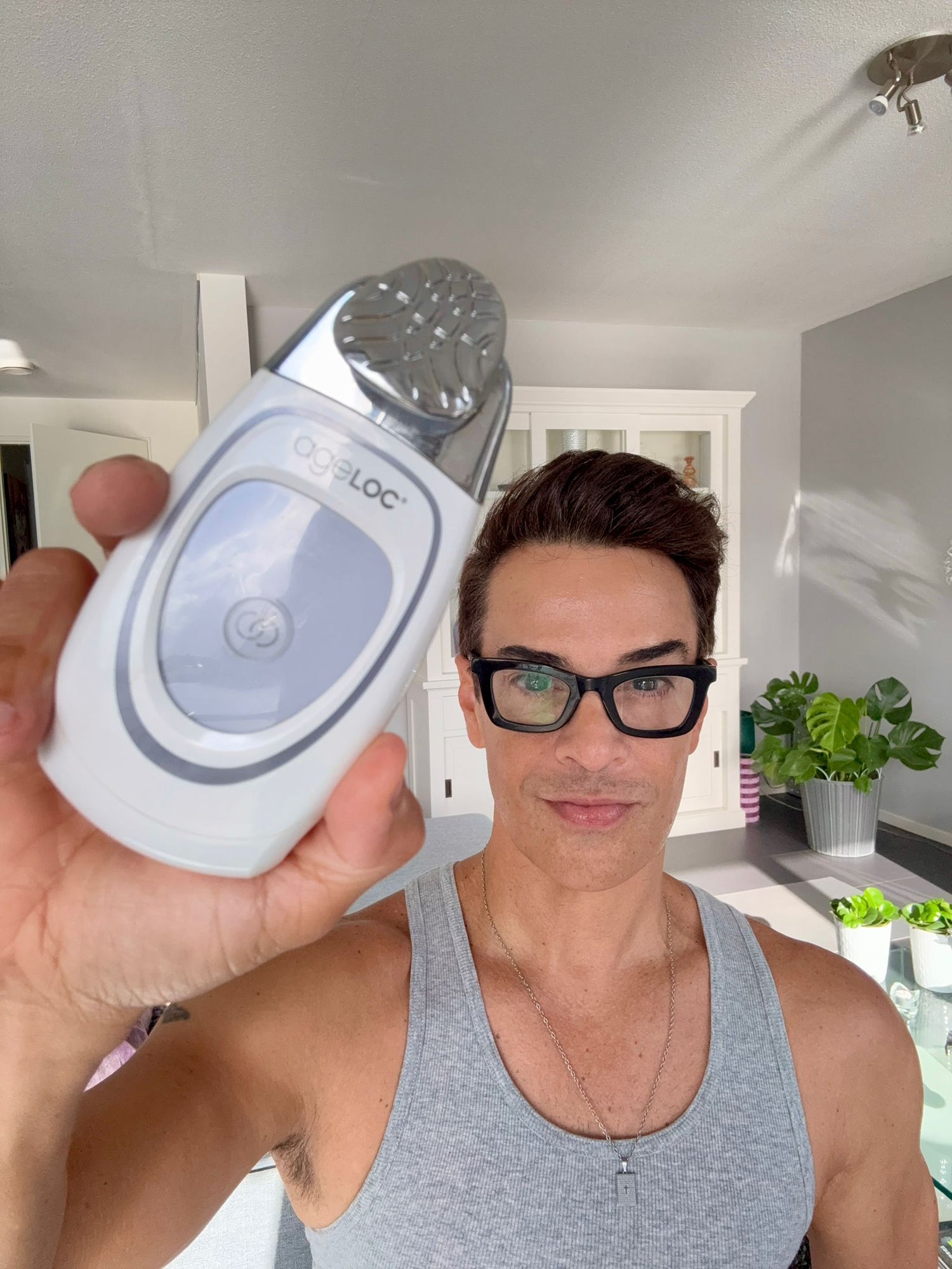 Edson Brandão holding Galvanic Face Spa