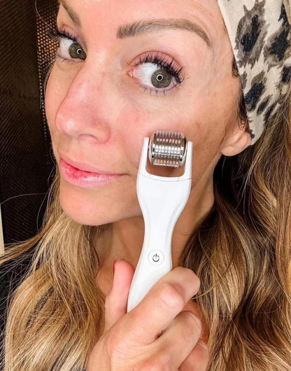 Woman using a GloPRO skin care device on her face
