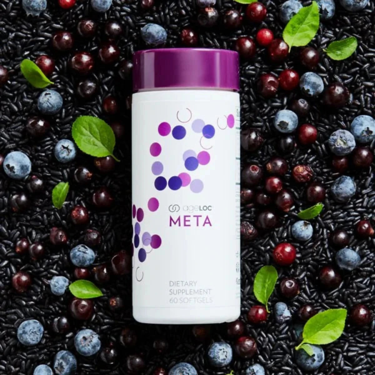 Supplement bottle with purple cap and label surrounded by black rice, blueberries, and cranberries.