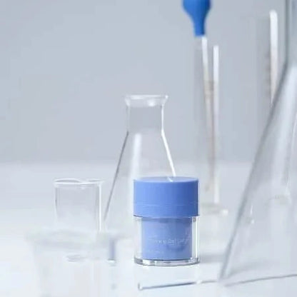 Blue container with a white lid on a light gray background