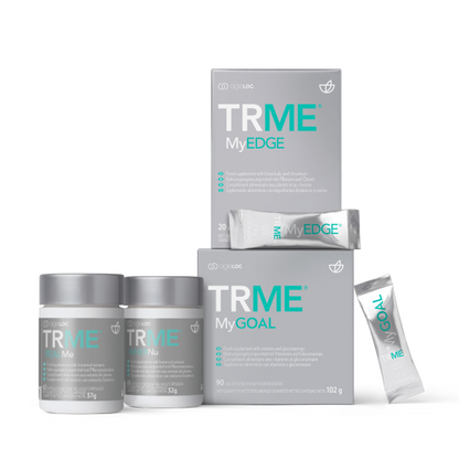 A set of Nu Skin AgeLOC TRME wellness management kit products, including containers and boxes with branding visible.