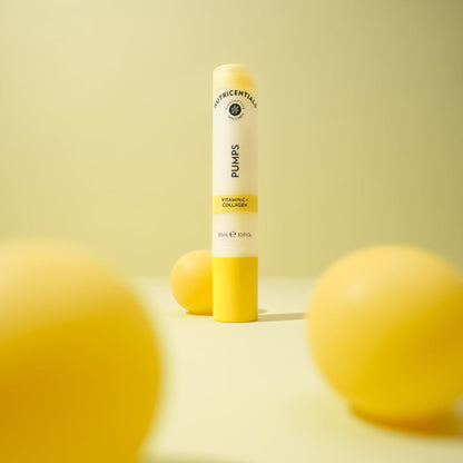 Nu Skin Vitamin C Pump Serum Surrounded By Lemons